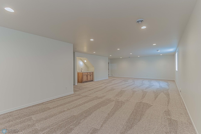 carpeted empty room with sink