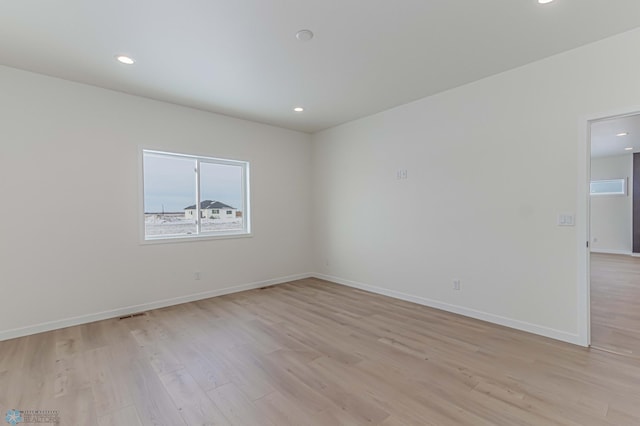 unfurnished room featuring light wood-type flooring