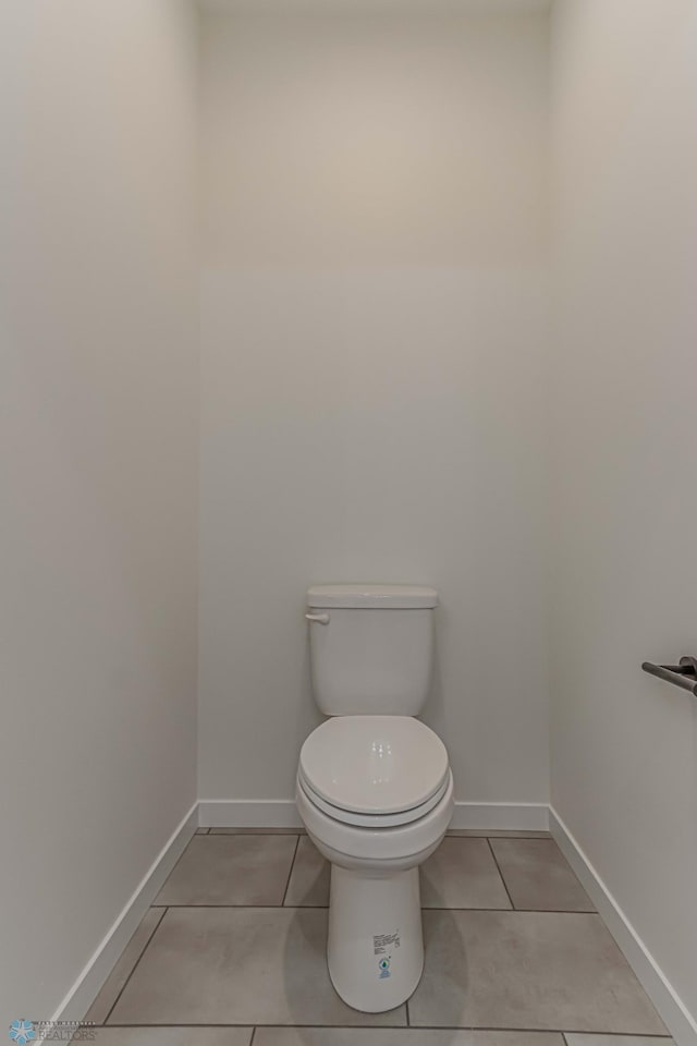 bathroom with tile patterned floors and toilet