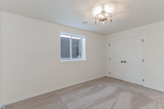 unfurnished bedroom featuring light colored carpet