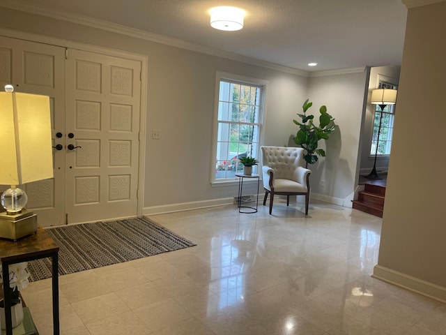 foyer featuring crown molding