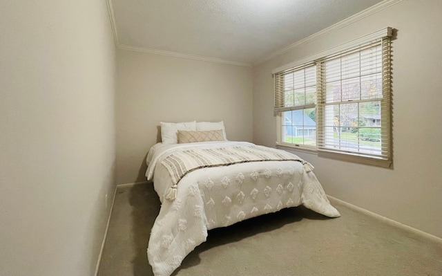 bedroom featuring ornamental molding and carpet floors