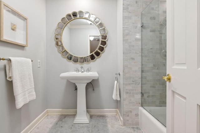 bathroom featuring combined bath / shower with glass door