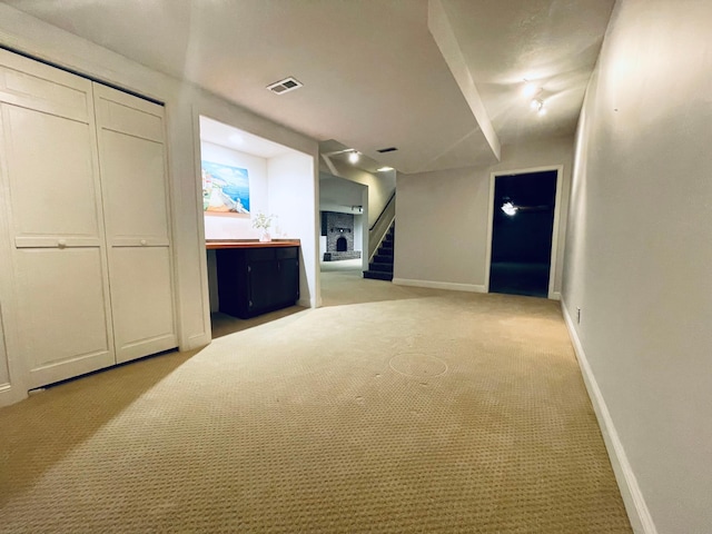 interior space featuring light colored carpet