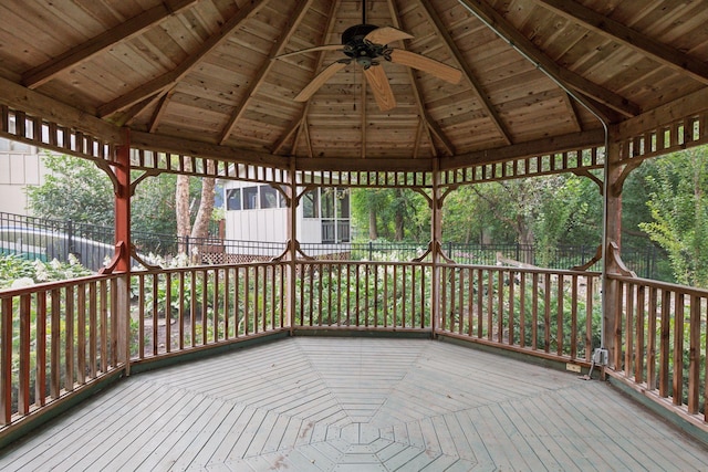 wooden deck featuring a gazebo and ceiling fan