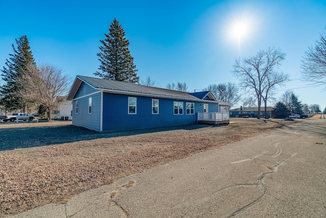 view of side of property with a deck