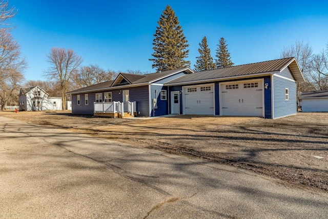 view of front of property with a garage and covered porch