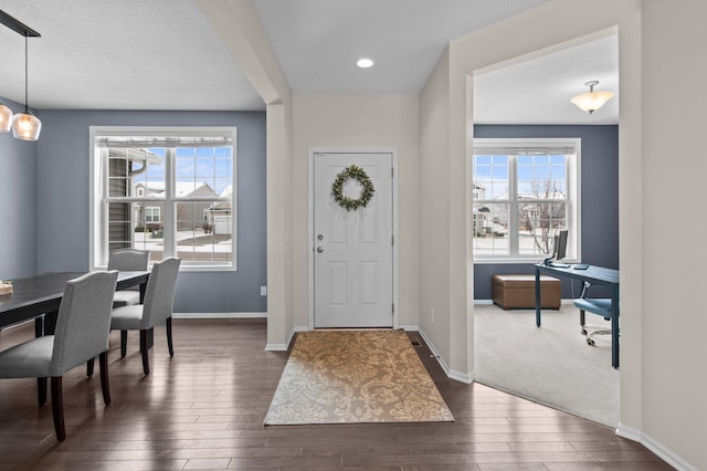 entrance foyer with dark hardwood / wood-style floors