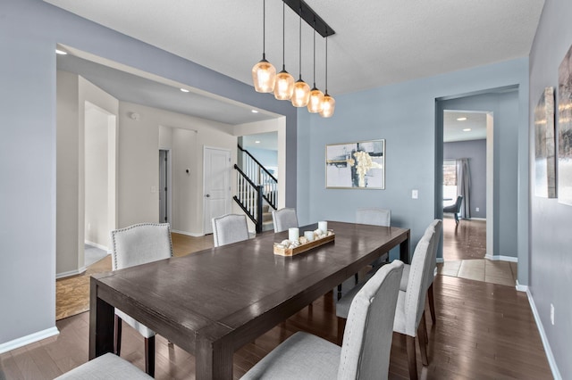 dining area with dark hardwood / wood-style floors