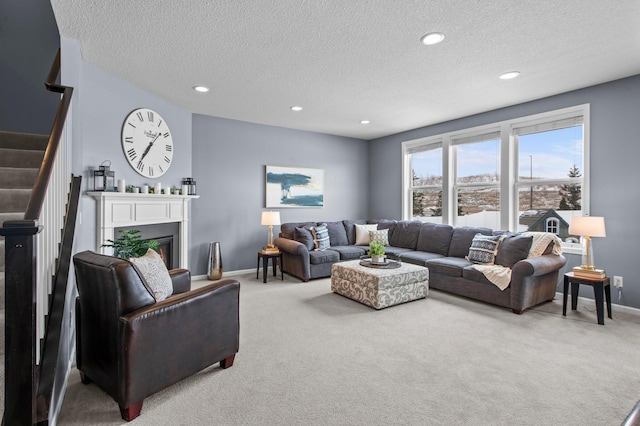 carpeted living room with a textured ceiling