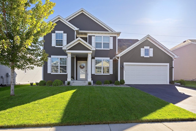 view of front facade with a garage and a front yard