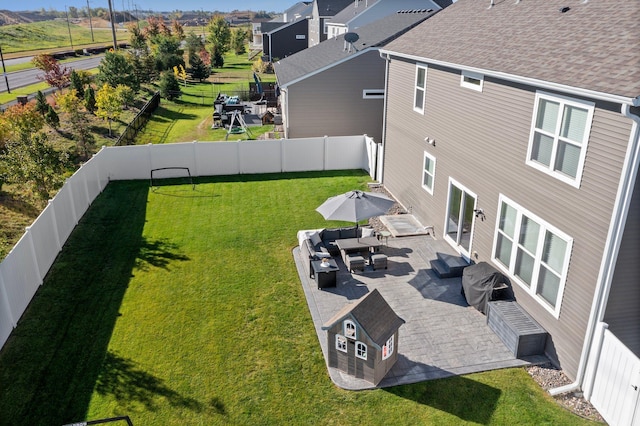 view of yard with an outdoor living space and a patio