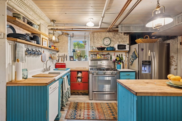 706 4th St, Red Wing, MN 55066 - kitchen featuring wooden counters, stainless steel appliances, and open shelves