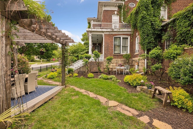 706 4th St, Red Wing, MN 55066 - view of yard featuring a wooden deck, a pergola, and a balcony