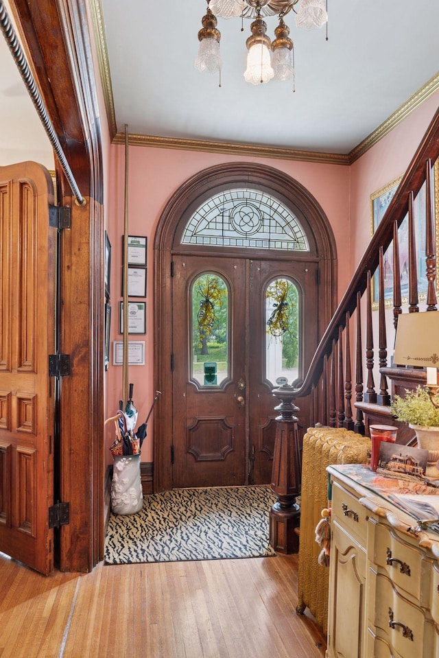 706 4th St, Red Wing, MN 55066 - entryway featuring light wood-style flooring, stairway, and crown molding