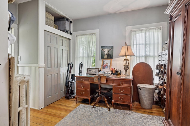 706 4th St, Red Wing, MN 55066 - home office featuring light wood finished floors and a wainscoted wall