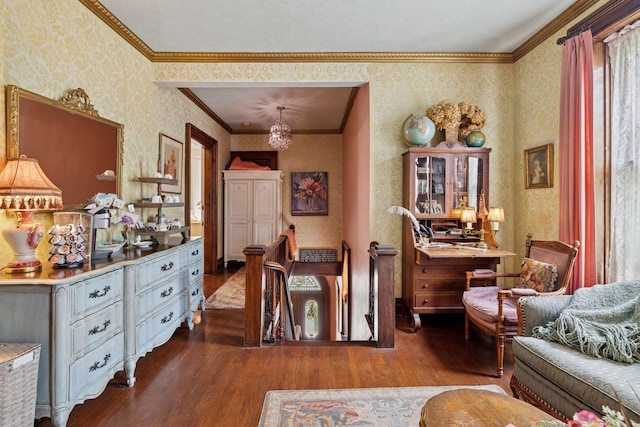 706 4th St, Red Wing, MN 55066 - sitting room with wallpapered walls, wood finished floors, crown molding, and a chandelier