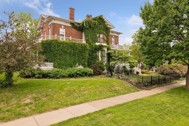 706 4th St, Red Wing, MN 55066 - view of home's exterior with a chimney and brick siding