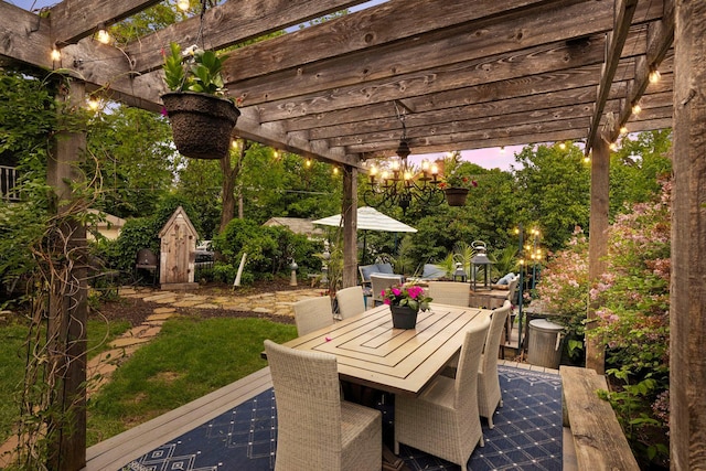 706 4th St, Red Wing, MN 55066 - patio terrace at dusk with outdoor dining area and a pergola