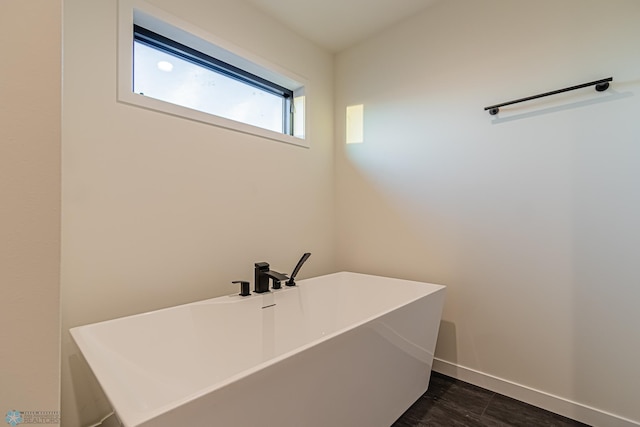 bathroom with a tub and sink