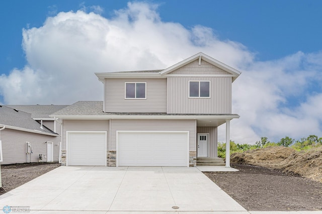 1264 Marlys Dr W, West Fargo, ND 58078 - view of front of property featuring stone siding, driveway, a shingled roof, and a garage