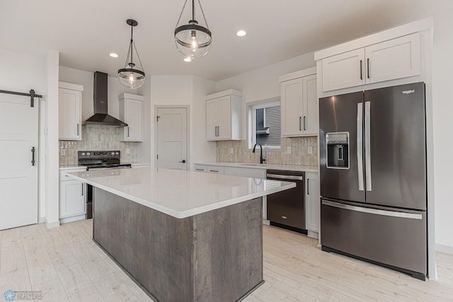 1264 Marlys Dr W, West Fargo, ND 58078 - kitchen with appliances with stainless steel finishes, wall chimney range hood, light countertops, tasteful backsplash, and a kitchen island
