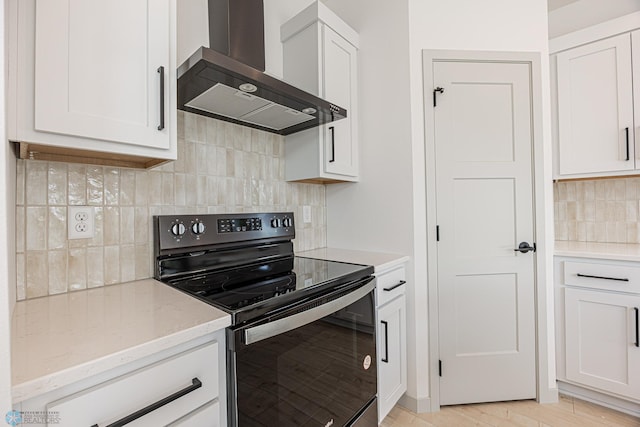 1264 Marlys Dr W, West Fargo, ND 58078 - kitchen with electric stove, wall chimney range hood, backsplash, light stone countertops, and white cabinetry