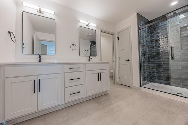 1264 Marlys Dr W, West Fargo, ND 58078 - full bath with double vanity, a shower stall, and tile patterned floors
