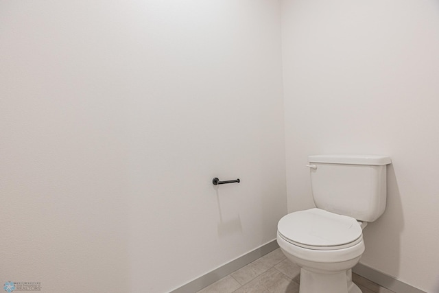 1264 Marlys Dr W, West Fargo, ND 58078 - bathroom featuring toilet and tile patterned flooring