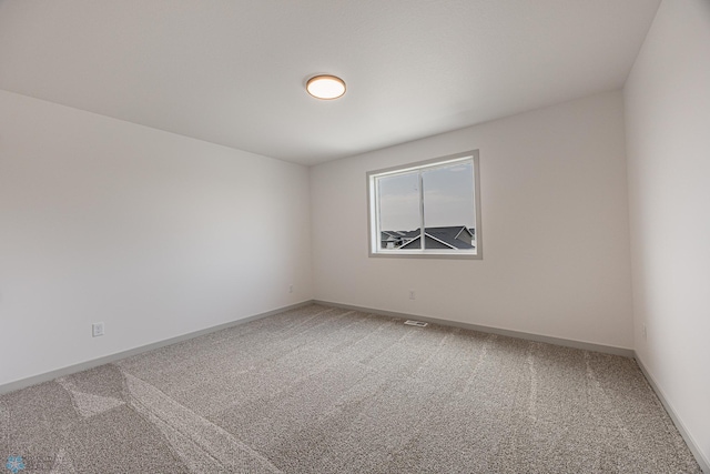 1264 Marlys Dr W, West Fargo, ND 58078 - spare room with light colored carpet and baseboards