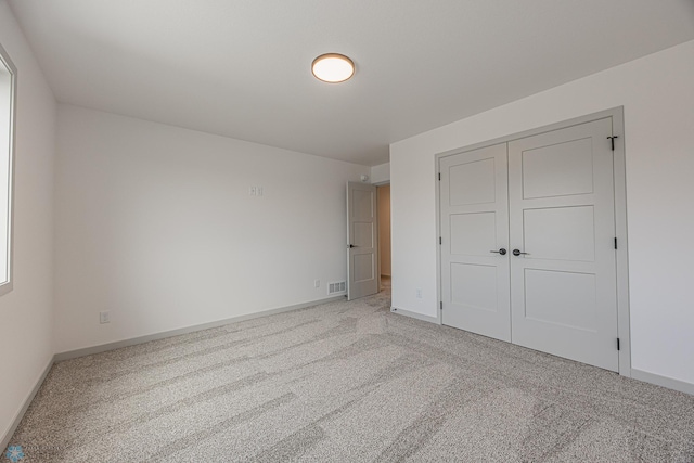 1264 Marlys Dr W, West Fargo, ND 58078 - unfurnished bedroom featuring light colored carpet and a closet