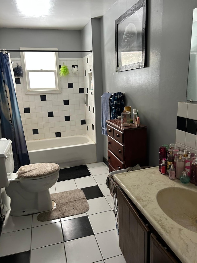 full bathroom featuring tile patterned flooring, vanity, shower / bath combination with curtain, and toilet