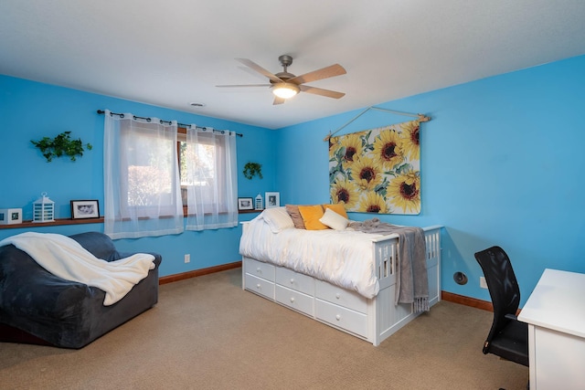 bedroom with light carpet, a ceiling fan, and baseboards