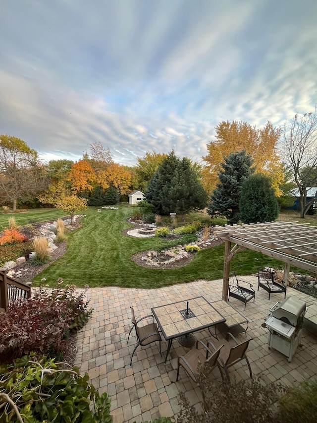 surrounding community featuring a yard and a patio