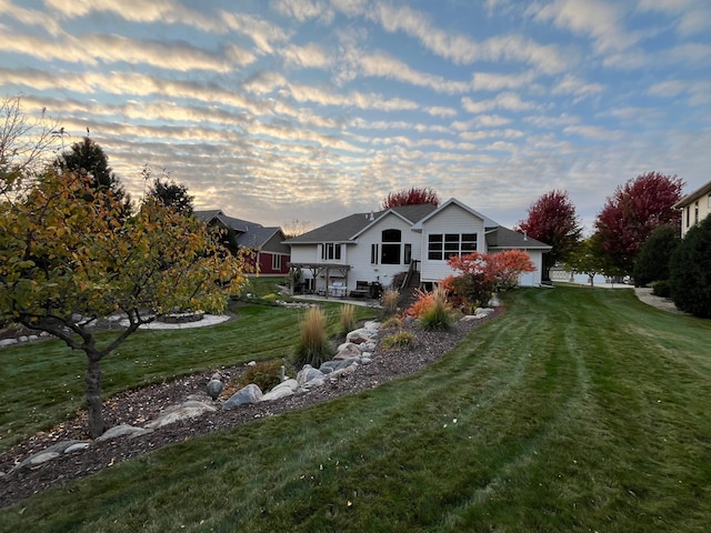 back of house with a yard