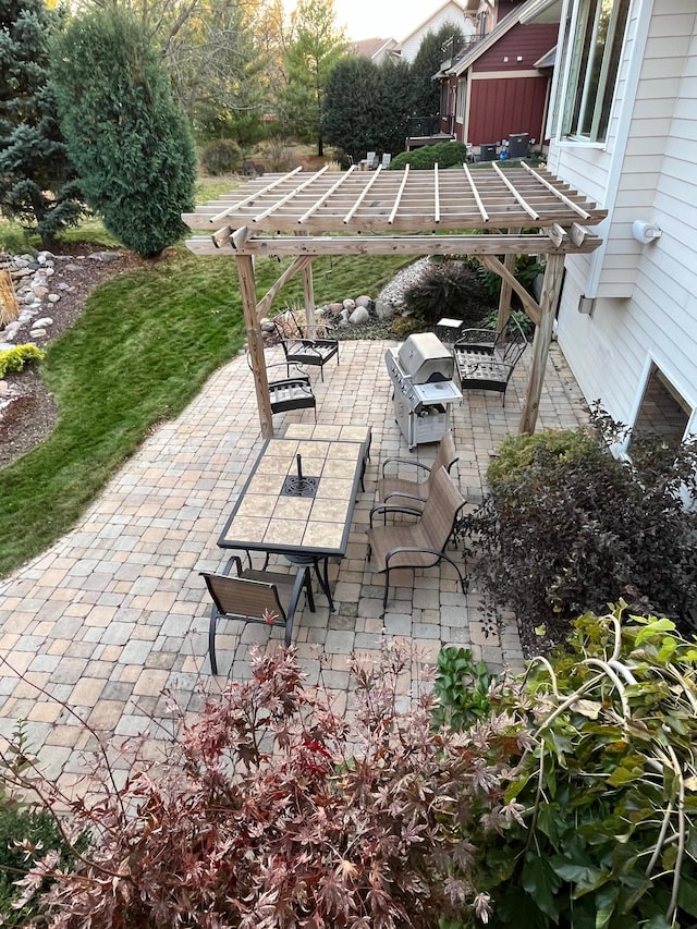 view of patio / terrace featuring grilling area and a pergola