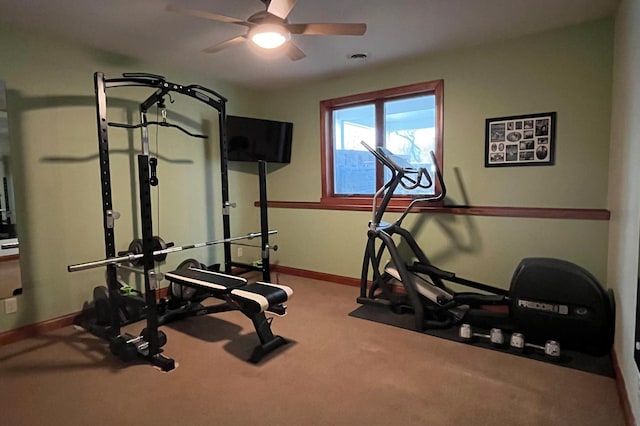 workout room featuring carpet, baseboards, and a ceiling fan