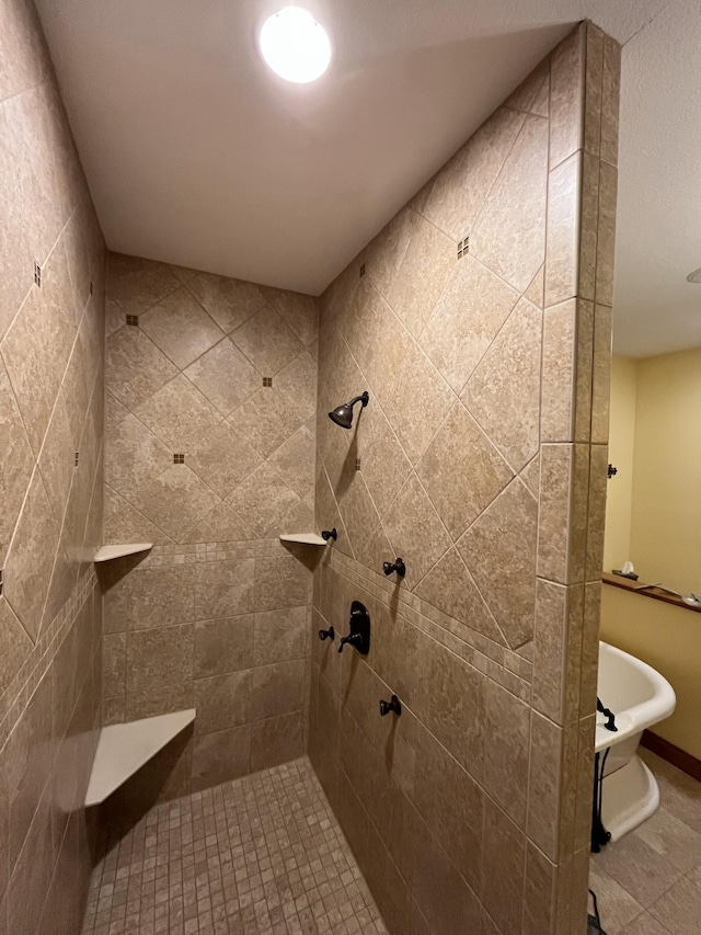 full bath featuring tiled shower