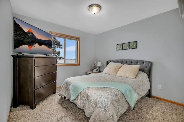 bedroom with light colored carpet