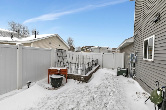 view of yard layered in snow