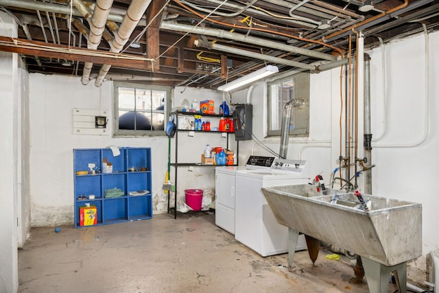 below grade area with washer and clothes dryer and a sink