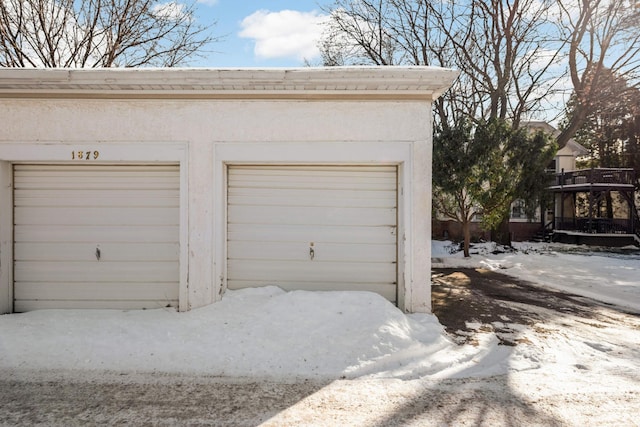 view of snow covered garage