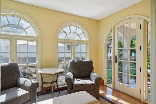 living area with hardwood / wood-style floors