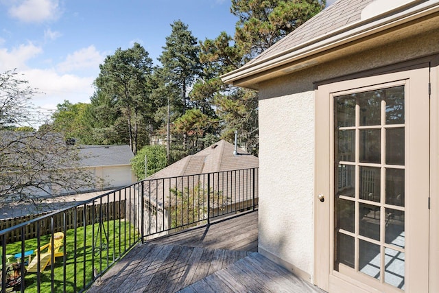 wooden deck with a yard