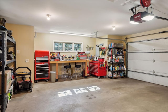 garage featuring a garage door opener and a workshop area