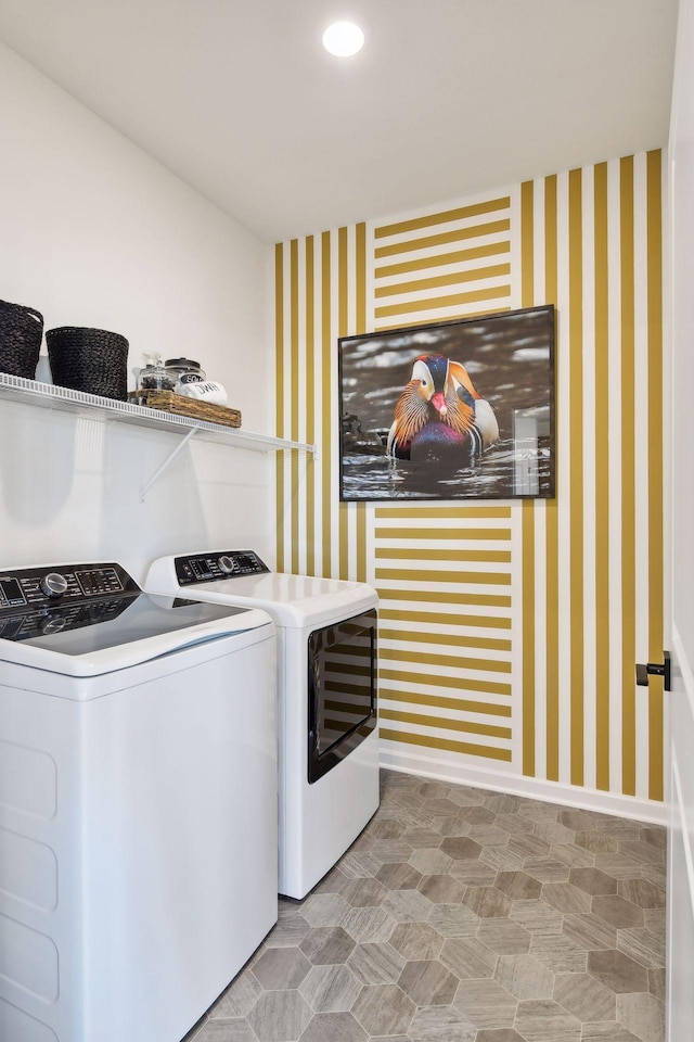 washroom featuring washing machine and clothes dryer