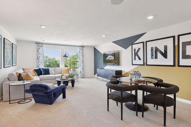 living room with lofted ceiling and light colored carpet