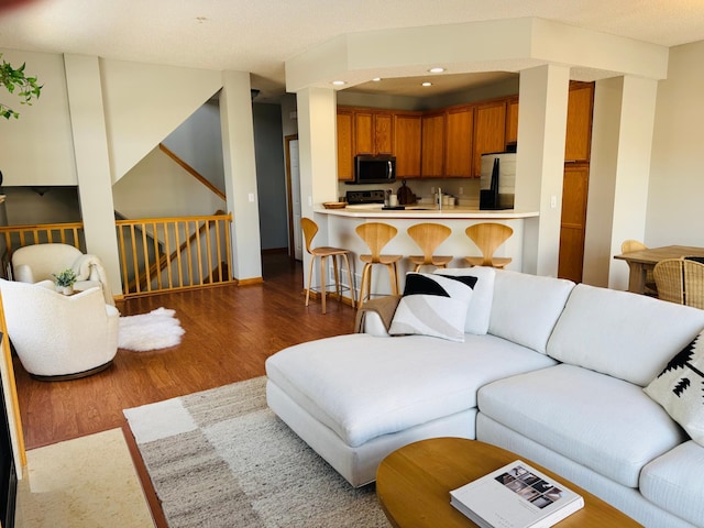 living area featuring recessed lighting and wood finished floors