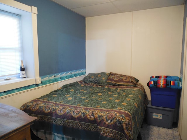 bedroom featuring a drop ceiling