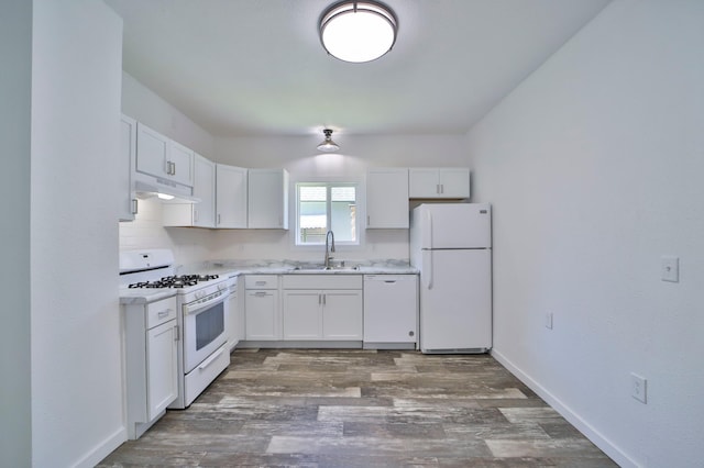 kitchen featuring white cabinetry, dark hardwood / wood-style flooring, sink, and white appliances